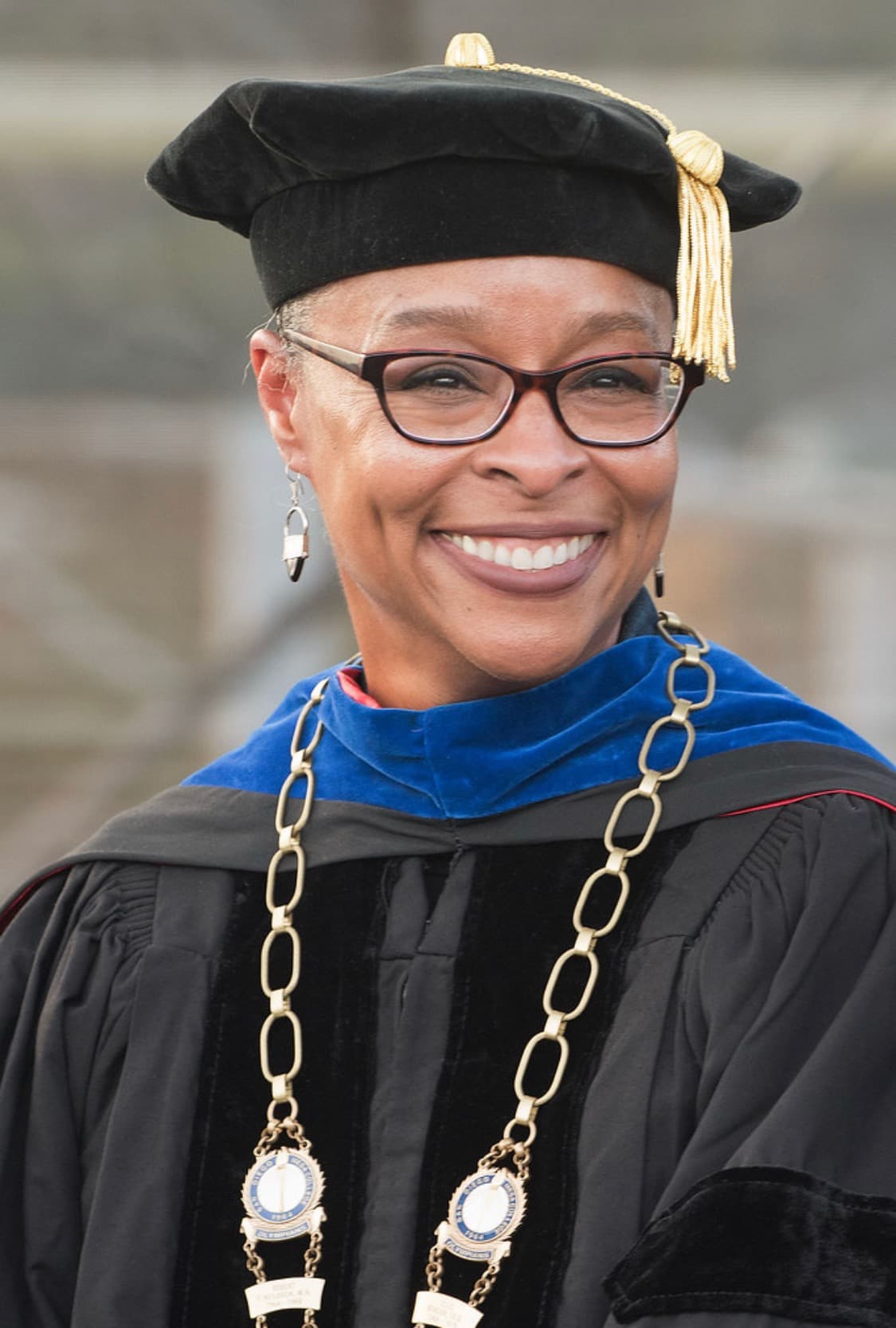 President Ashanti Hands in cap and gown