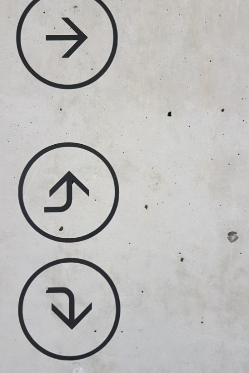 wall with arrows pointing in different directions