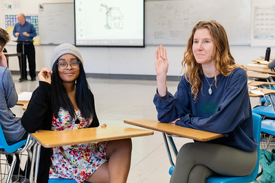 ASL students signing with each other in a classroom